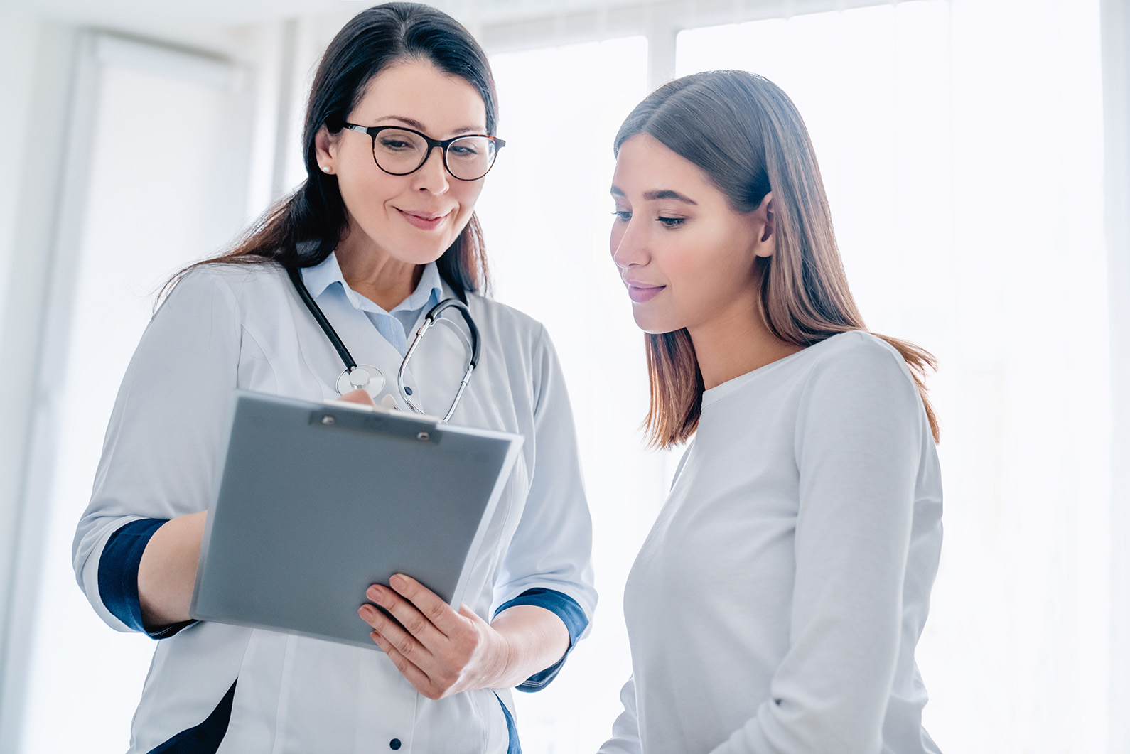Doctor reviewing care details with a patient